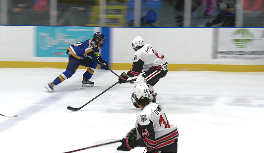 #20 Sean Clarke charges across the blue line.