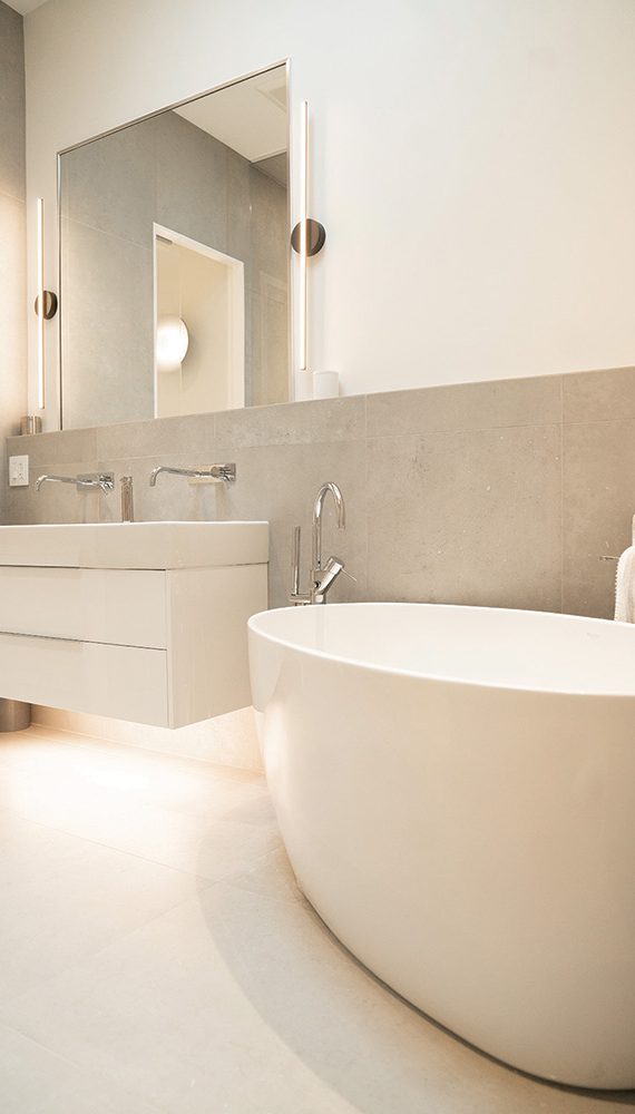 The “clean lines” design approach runs through every detail of the home, like this bathroom vanity light.