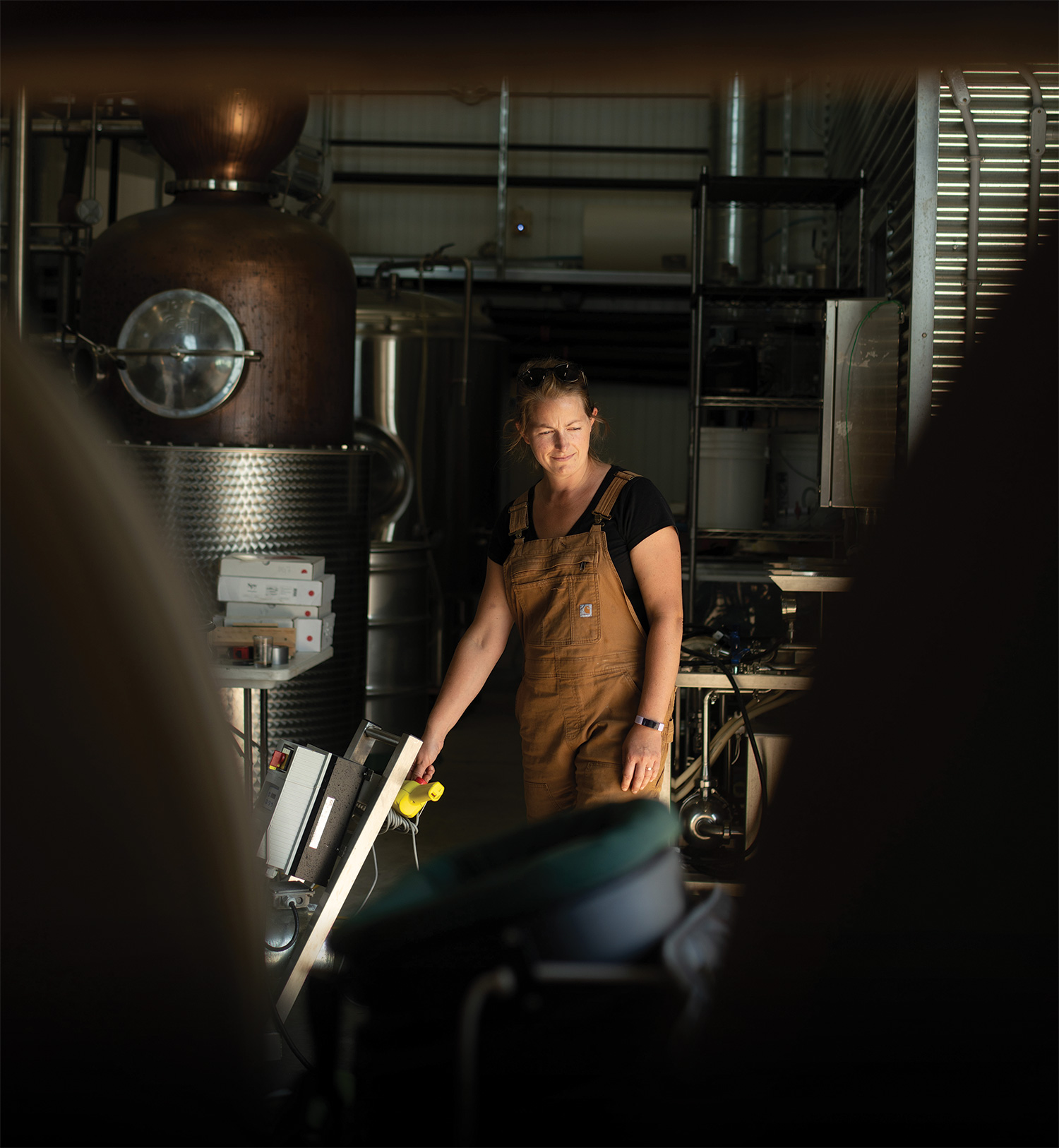 Distiller Martha Lowry in production at the cidery’s state-of-the-art facility.