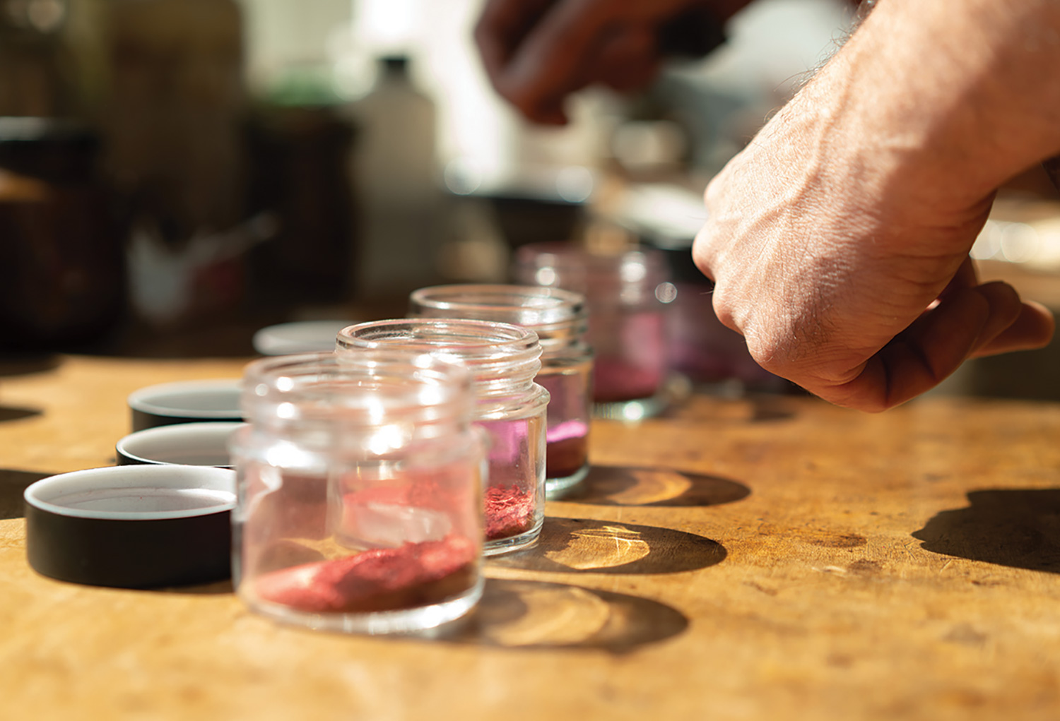 Mark Schnurr grinds his own pigments for varnishes out of plants and insects.