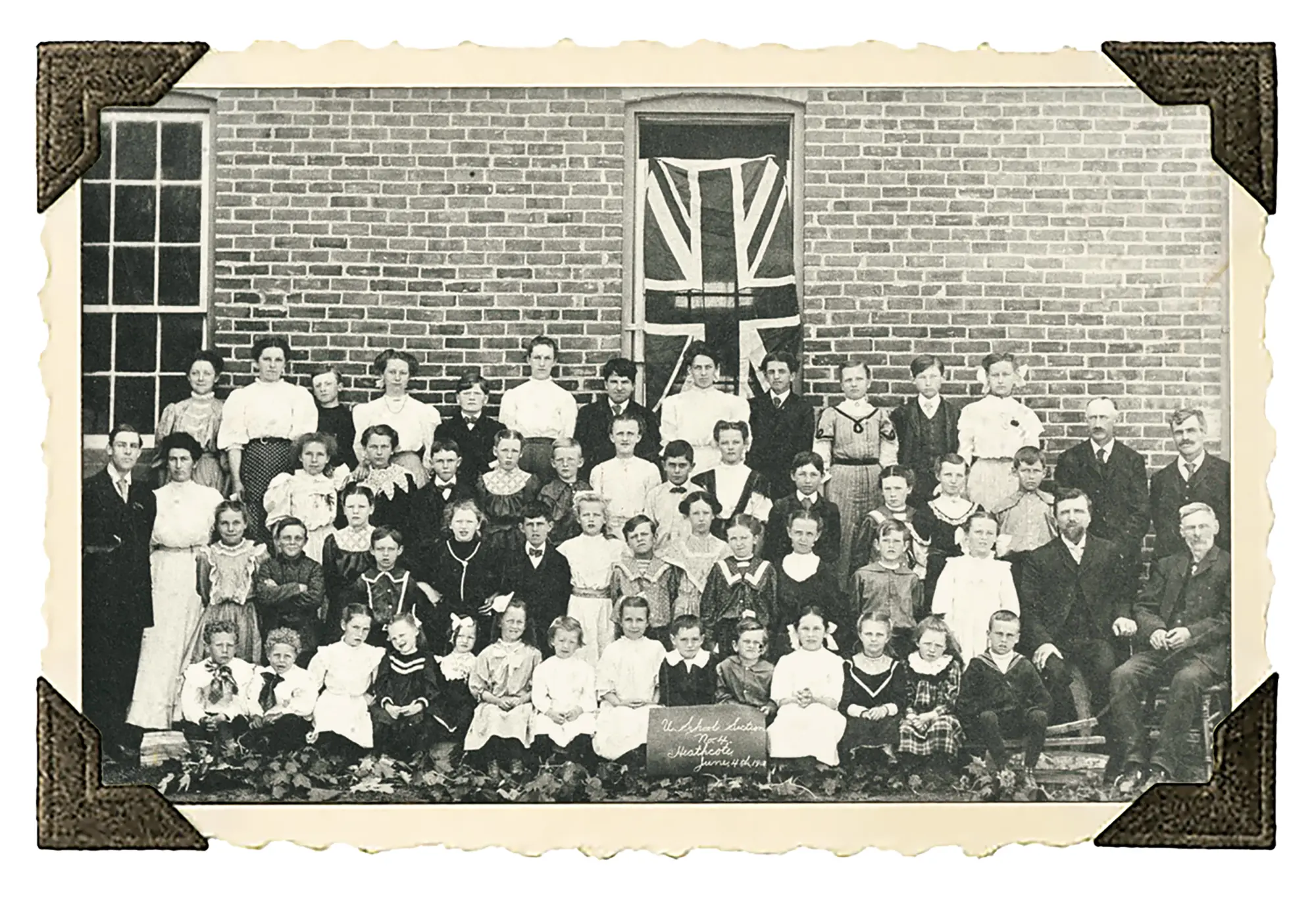 ABOVE: In 1908. Back row: May Vamplew, Ethel Irwin, Bob Camplin, Pearl Irwin, Clarence Cruickshank, Mary Reekie, Edgar Irwin, Lucy Green, Albert Irwin, Myrtle Isaac, Jesse Prentice, Jean Milne. Third row: teachers Russel Kirkham and Henrietta Moore, Alice Vickers, Marion Prentice, Dow Fulford, Minnie Fulford, Clarence Vamplew, Hazel Bovair, Johnnie Shultz, Florence Gardiner, Elmer Vamplew, Laura Wilson, Laura Isaac, George Milne, secretary Walter Roke, trustee Joseph Wilson. Second row: Victoria Vickers, Percy Atkins, Nellie Fulford, Ross Gardiner, Florence Cruickshank, Billie Bovair, Irene Gardiner, Percy Devins, Elda Rorke, Audrey Wilson, Rosella Isaac, Harvey Cruickshank, Vivian Hutchinson, trustees Chas. Irwin and George Reekie. Front row: Frank Vickers, Fred Vickers, Stella Fulford, Gladys Hutchinson, Grace Cruickshank, Fern Hutchinson, Sadie Rorke, Viola Maxwell, Billie Fulford, Harold Cruickshank, Alma Irwin, Jemima Isaac, Sarah Kerr, Joe Green.