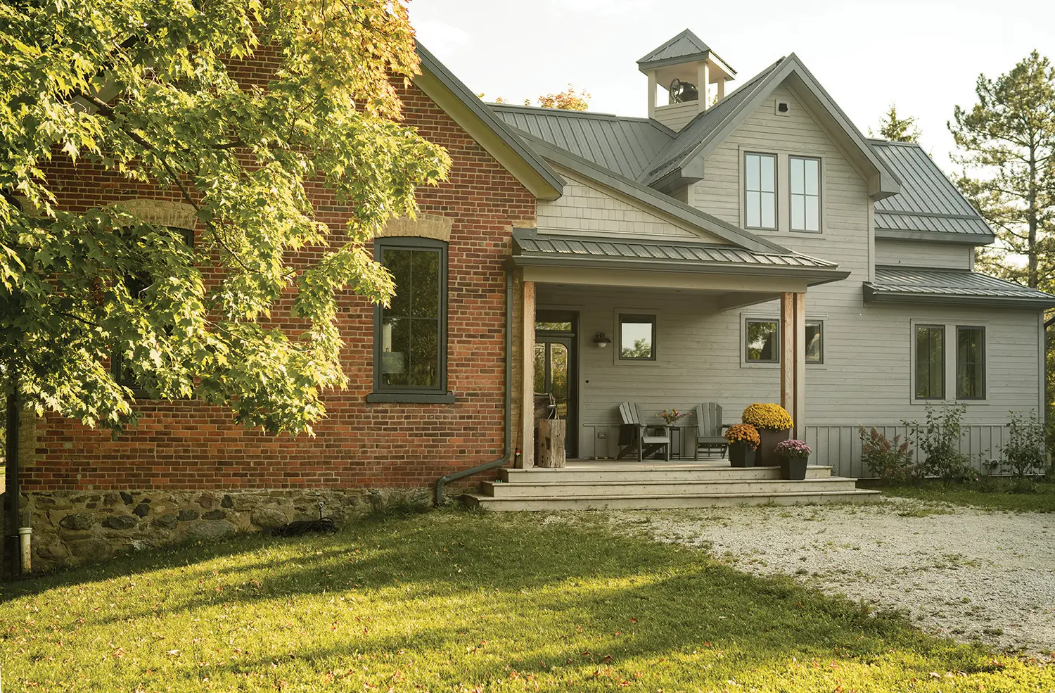 The spacious front porch overlooks Ashley’s huge fenced garden where she has a flower cutting bed and grows veggies, as well as a separate coop housing nine chickens.